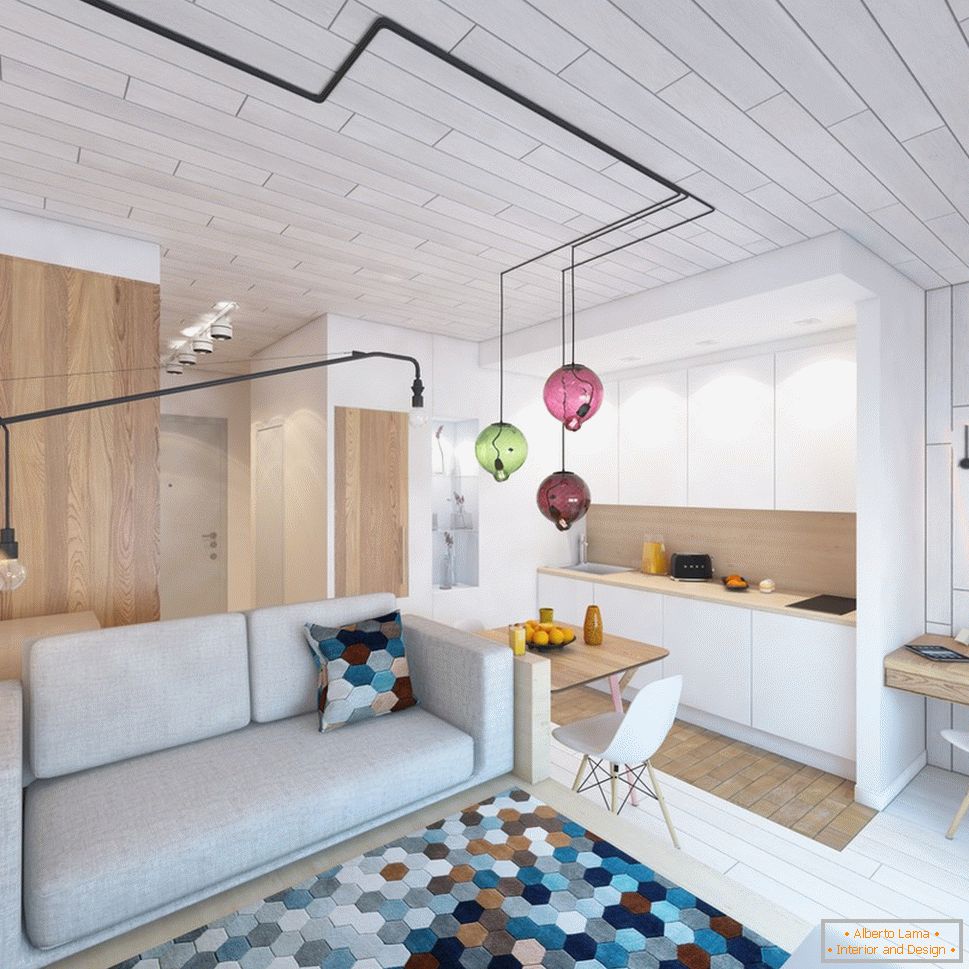 Diseño interior de un pequeño apartamento con acentos brillantes