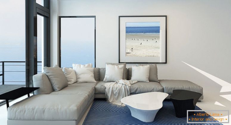 Moderna sala de estar frente al mar con un interior amplio y luminoso salón con una confortable suite moderna tapizada gris, arte en la pared y una gran ventana panorámica a lo largo de una pared con vistas al océano