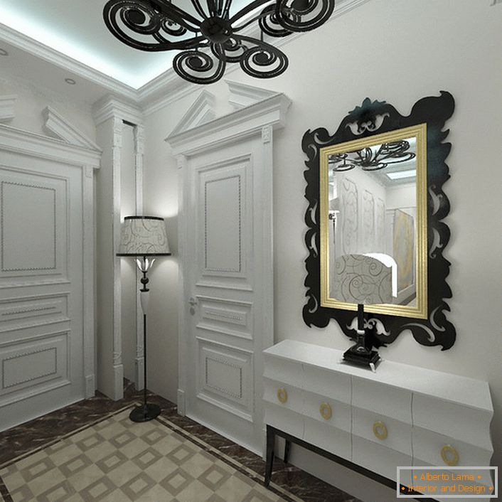 Al estilo Art Deco le gustan los tonos claros en el interior. La entrada, decorada en blanco, destaca por elementos decorativos de contraste correctamente seleccionados.