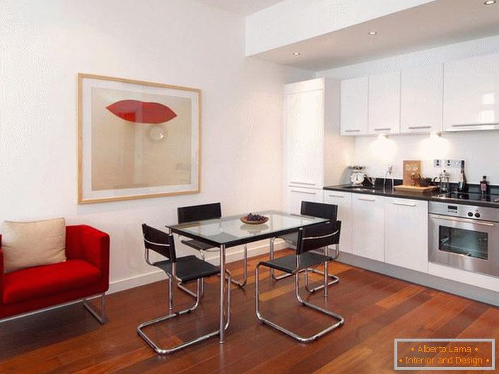 Cocina con estilo con acentos de rojo. El estilo minimalista es una opción ganar-ganar para el diseño de apartamentos tipo estudio. 