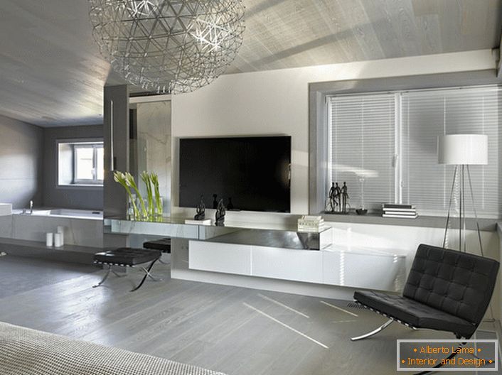 Un rasgo característico del estilo minimalista es el uso de un material de un solo color para la tapicería de muebles y elementos metálicos cromados.