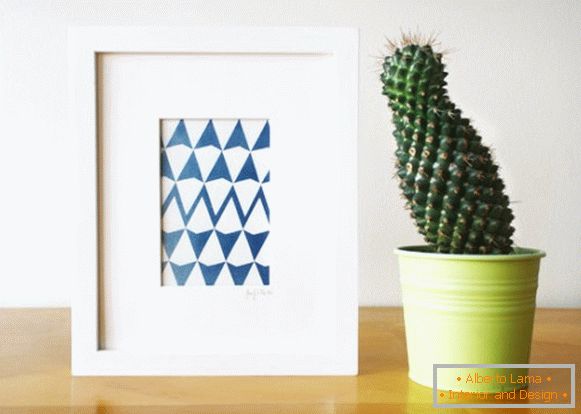 Una imagen con una impresión geométrica y un cactus