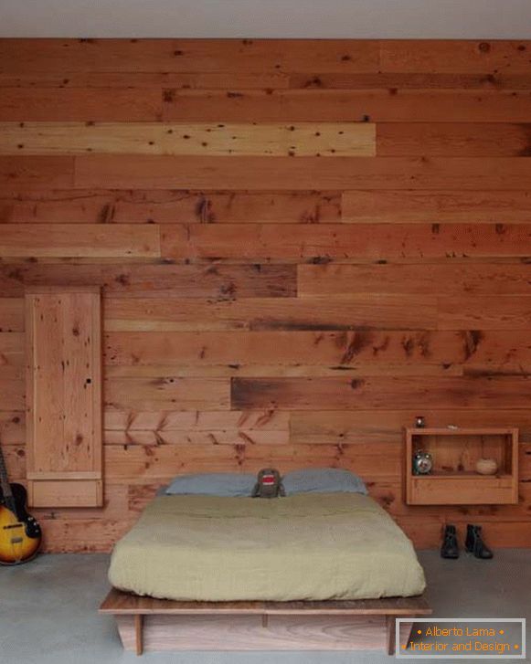Un dormitorio en un estilo minimalista, decorado con un árbol