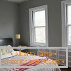 Dormitorio interior en tonos grises