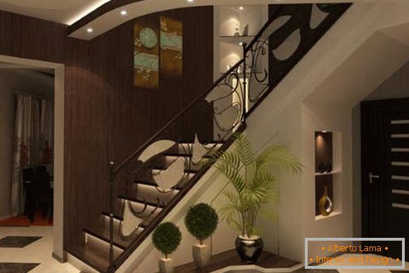Diseño de un hall de entrada con una escalera en una casa privada en tonos oscuros