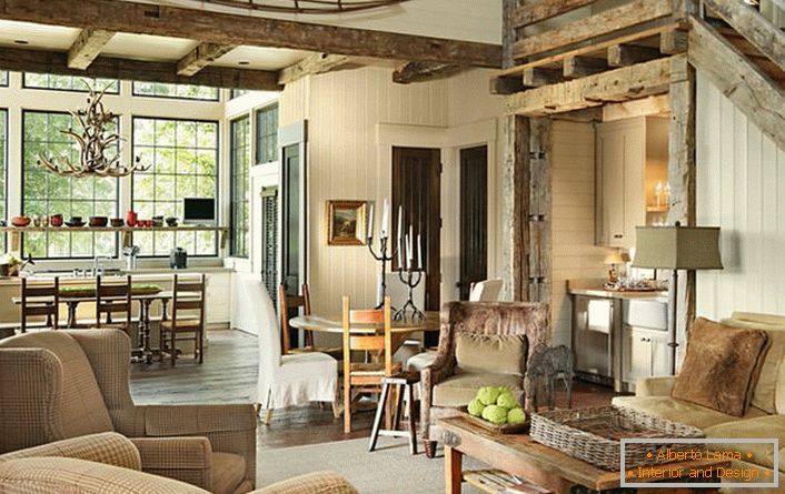 La combinación de muebles y muebles correctamente elegida en el interior de la sala de estar hace que el estilo del pueblo sea una solución creativa e inusual para la decoración. 