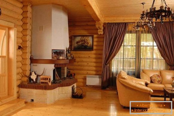 Interior moderno de una casa de madera de troncos dentro - foto