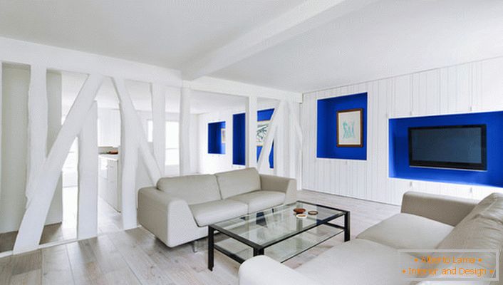 La sala de estar del estudio está separada por una mampara de yeso. Una solución elegante para el diseño creativo.