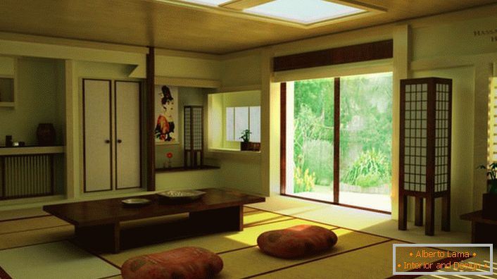 Acerca de la presencia de minimalismo japonés en la sala de estar en una casa de campo le dice a los muebles adecuados. Una mesa baja es ideal para beber té en casa. 
