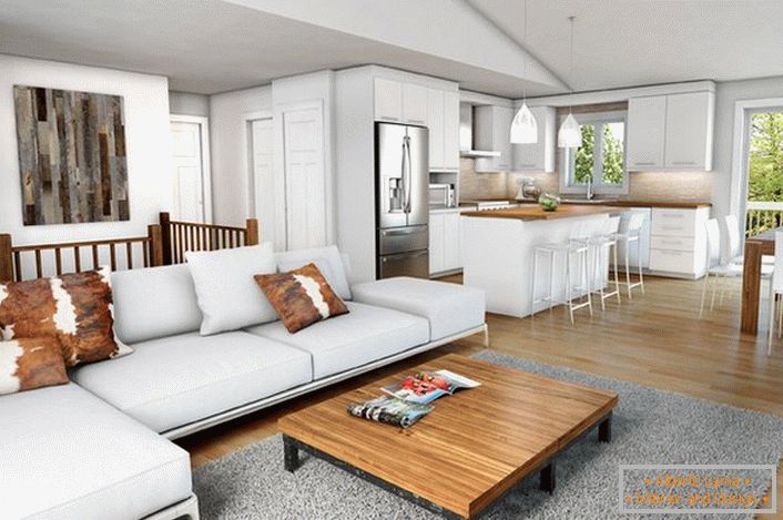 Chalet moderno en el diseño interior de una casa de campo. Lacónicos y cómodos muebles hacen que el ambiente sea cálido y confortable. 