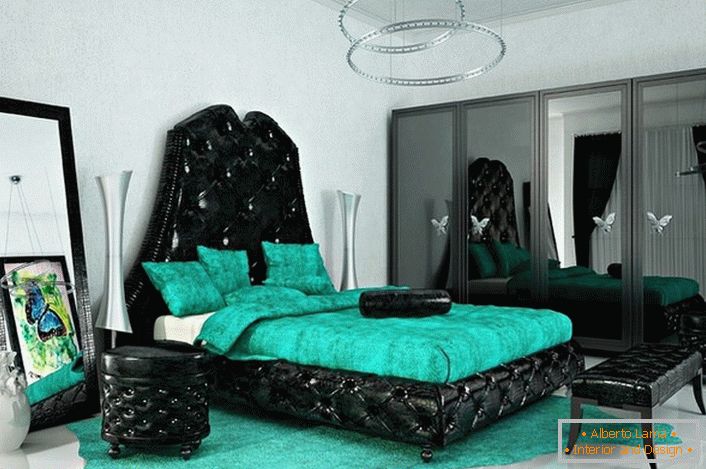 Colores brillantes y pegadizos para el estilo art deco. El color esmeralda combina armoniosamente con el negro. Dormitorio ideal para una persona creativa.