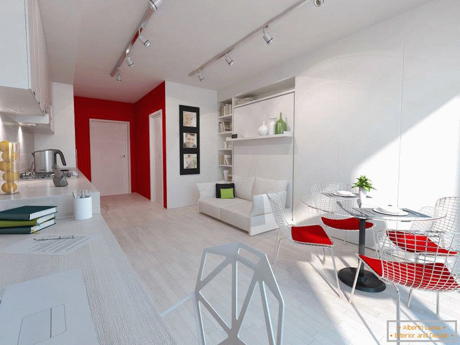 Interior blanco de un pequeño apartamento con detalles en rojo