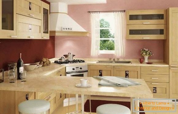 El interior de la cocina de la esquina con una barra de mostrador - una foto en tonos beige y rosa