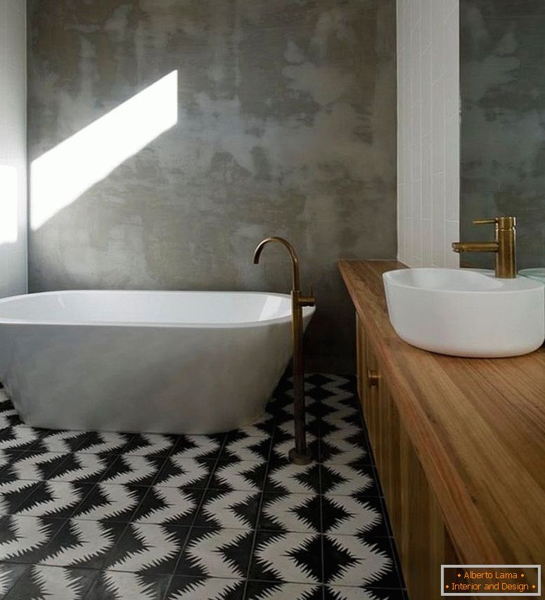 Paredes de concreto renderizado del baño con soporte en contraste con las baldosas de cemento geométricas